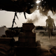 Dust from the grinding machine hangs heavy in the air at an informal mining site, near Sowerda, Sudan.